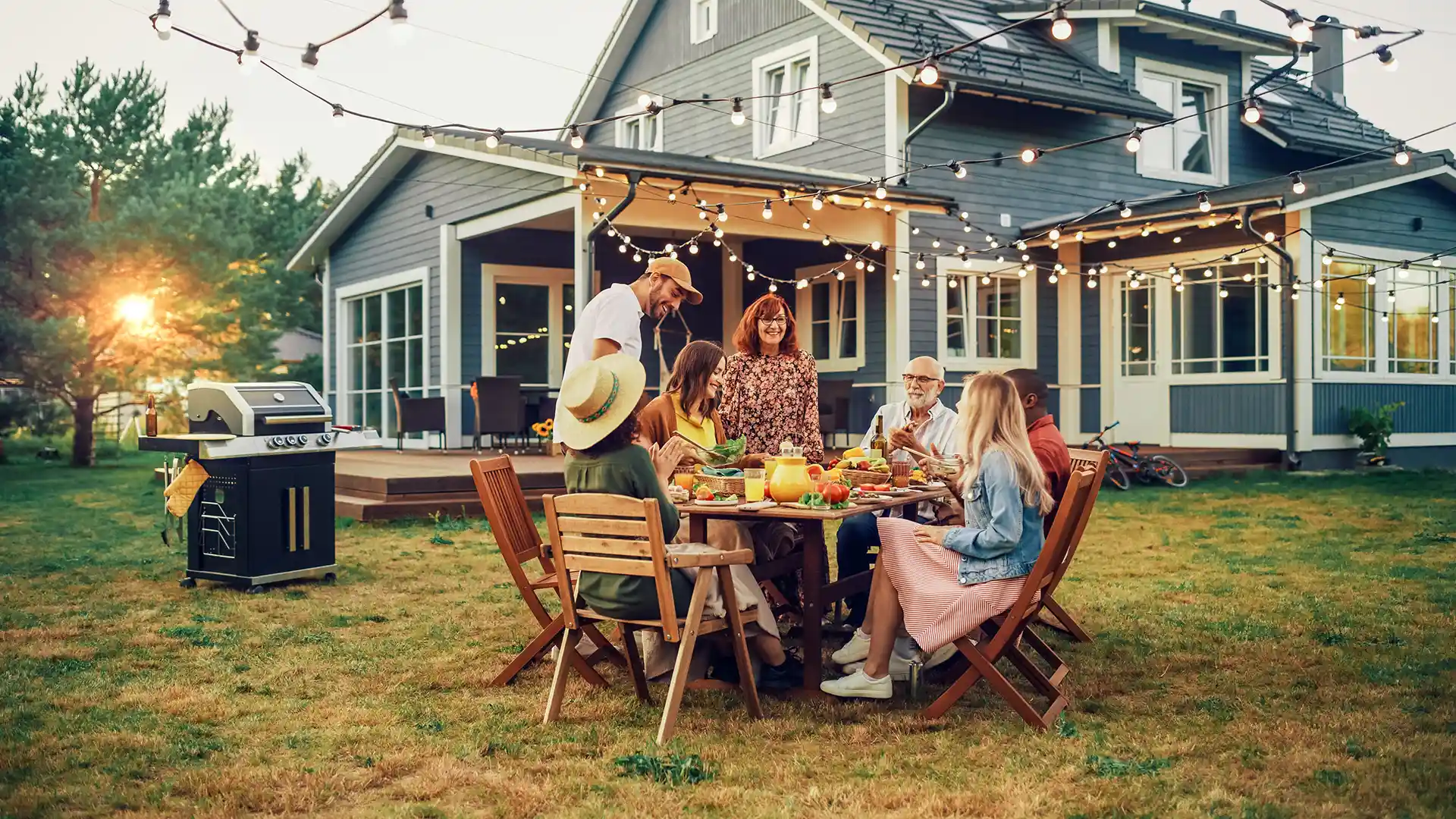 Family enjoying a pest-free backyard dinner